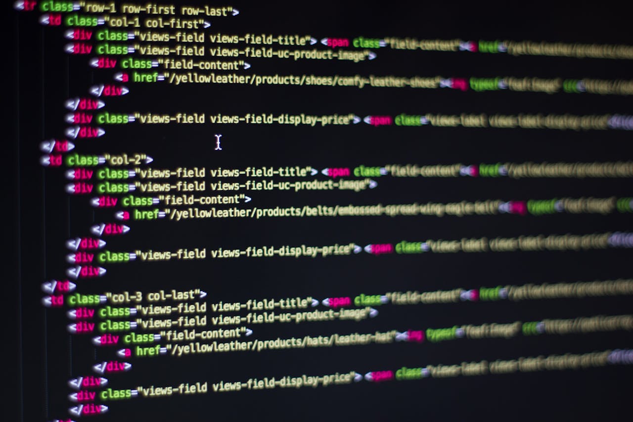 services-02 Detailed close-up of HTML code on a computer monitor, showcasing web development.