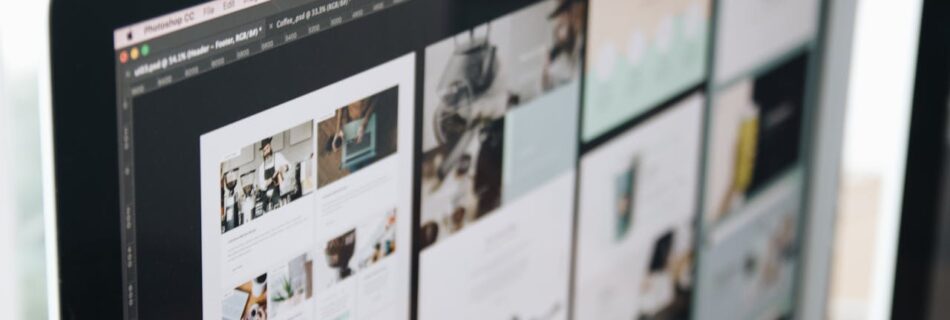 A modern computer screen displaying web design work, showcasing creative visuals in a workspace.